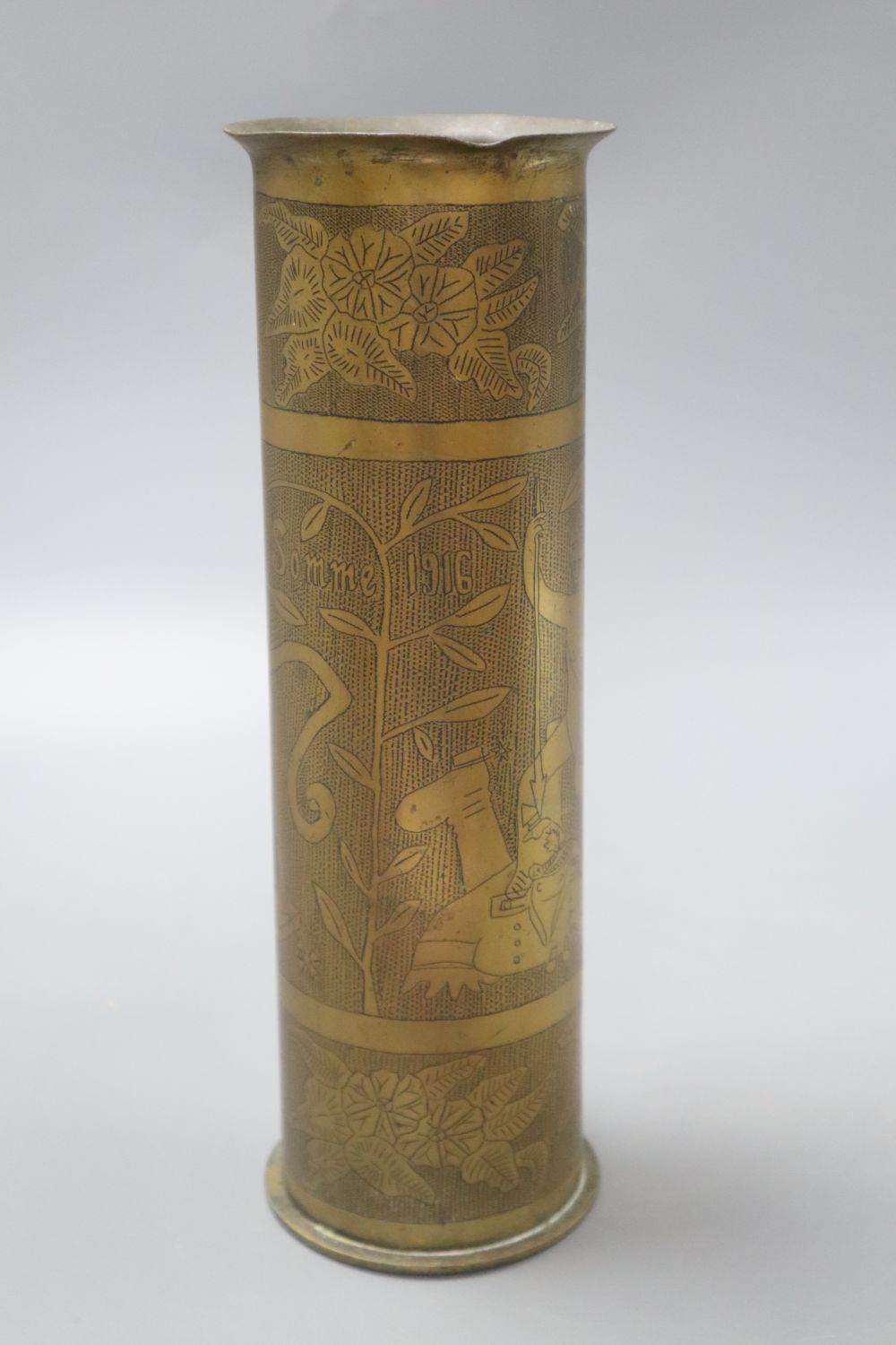 An early 20th century Trench Art vase reads Somme 1916 and Ypres 1914, height 27.5cm